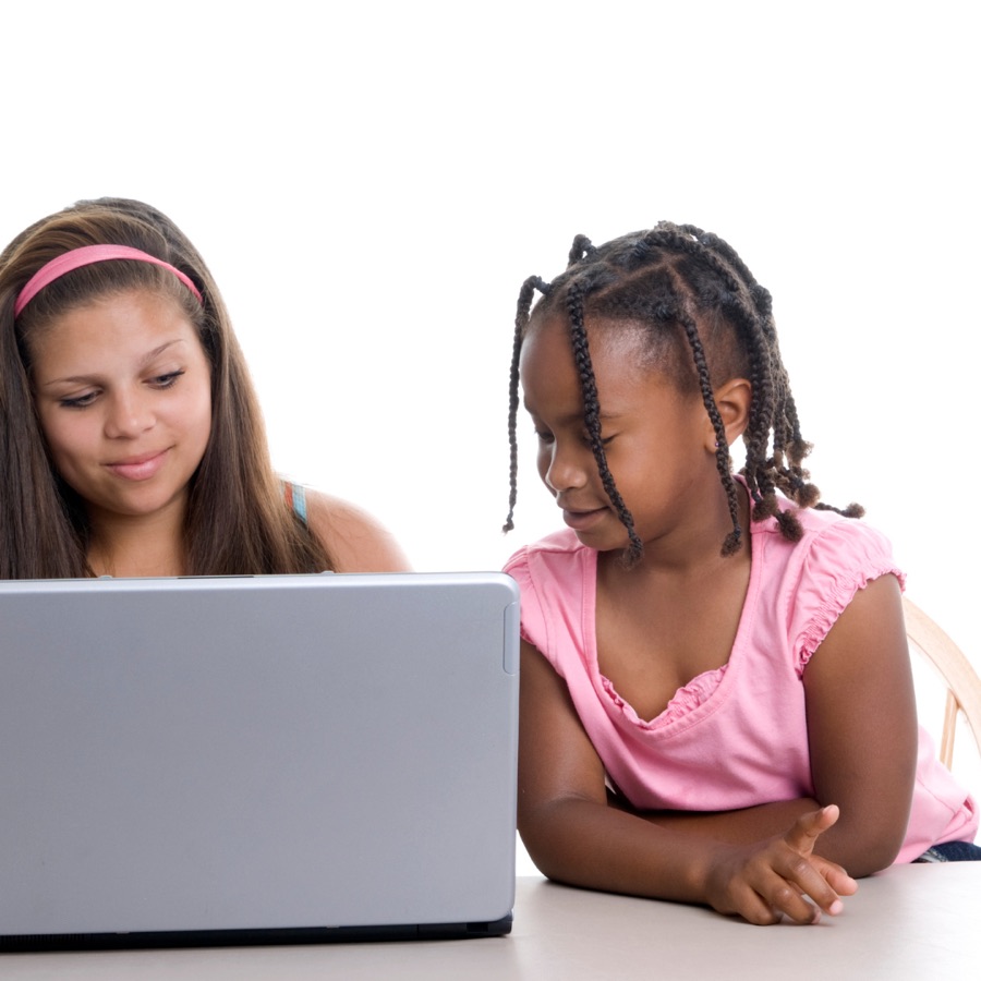 Two girls studying together on a laptop