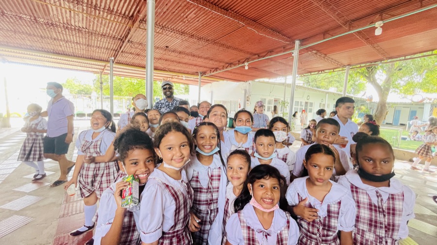 A large group of smiling uniformed students at Instituto Don Bosco